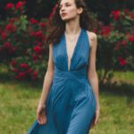 Rose Bushes - Barefoot Woman in Blue Maxi Dress Walk on Lawn