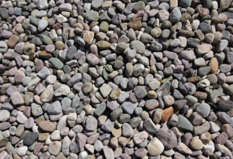 Xeriscaping - a pile of rocks sitting on top of a sidewalk