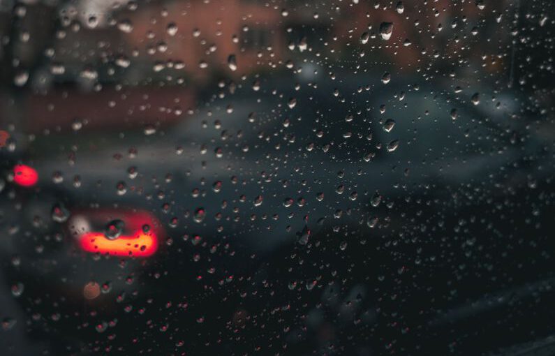 Vertical Space - water droplets on glass window