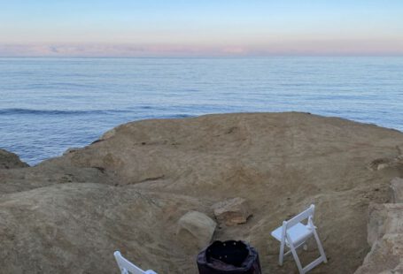 Soil PH Tester - a couple of white chairs sitting on top of a rocky beach