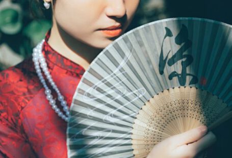 No-Till Garden - A woman in a red dress holding a fan