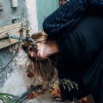 Drip Irrigation Systems - Woman drinking water from a Faucet